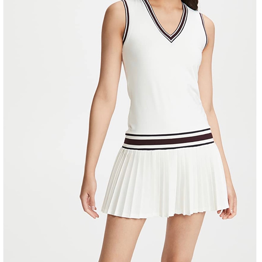 Tory Burch tennis dress features striped edges and a pleated skirt